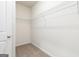 Walk-in closet features neutral carpeting and wire shelving at 1512 Big Bud Ln, Locust Grove, GA 30248