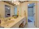 En-suite bathroom with dual sinks, shower, and floral accents on wallpaper at 2400 White Pine Ln, Mansfield, GA 30055