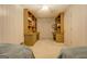A bedroom with a unique built-in desk and shelving unit, perfect for a home office or study area at 2400 White Pine Ln, Mansfield, GA 30055