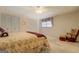 Spacious bedroom features neutral carpet, ceiling fan, and ample natural light at 2400 White Pine Ln, Mansfield, GA 30055