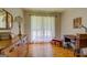 Cozy bedroom with hardwood floors and large window offering natural light at 2400 White Pine Ln, Mansfield, GA 30055