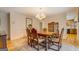 Traditional dining room with a wooden table set, hardwood floors, and view into the kitchen at 2400 White Pine Ln, Mansfield, GA 30055