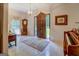 Elegant foyer with tile flooring, chandelier, wooden door, and vintage decor at 2400 White Pine Ln, Mansfield, GA 30055