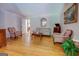Cozy living room with hardwood floors, classic furnishings, and natural light at 2400 White Pine Ln, Mansfield, GA 30055