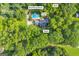 A sprawling property featuring a private pool, pump house and shed with the home nestled within lush greenery and treelines at 603 Lakewood Dr, Social Circle, GA 30025