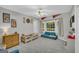 bedroom with sports memorabilia, bay window, and comfortable seating area at 603 Lakewood Dr, Social Circle, GA 30025