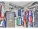 Walk in closet with clothes hanging on racks and a safe in the corner at 603 Lakewood Dr, Social Circle, GA 30025