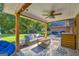 Cozy covered patio featuring stylish furniture, a ceiling fan, and convenient access to the backyard at 603 Lakewood Dr, Social Circle, GA 30025