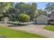 Beautiful home featuring a well-manicured lawn, a spacious driveway, and an attached garage at 603 Lakewood Dr, Social Circle, GA 30025