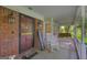 Cozy covered front porch featuring rocking chairs, a welcome mat, and an inviting entrance at 603 Lakewood Dr, Social Circle, GA 30025