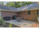 Backyard gravel patio featuring an outdoor dining set, perfect for enjoying outdoor meals at 603 Lakewood Dr, Social Circle, GA 30025