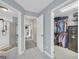 Hallway leading to bathroom and closet, showing entryways from multiple rooms, creating a sense of flow at 603 Lakewood Dr, Social Circle, GA 30025