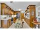 Traditional kitchen with ample cabinetry, modern appliances, marble countertops, and an island at 603 Lakewood Dr, Social Circle, GA 30025