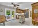 Well-appointed kitchen with tiled floors, stainless steel appliances and double doors leading to an outdoor area at 603 Lakewood Dr, Social Circle, GA 30025