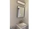 Clean bathroom with a granite countertop and a modern mirror at 90 Pat Mell Sw Rd, Marietta, GA 30060