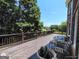 Inviting backyard deck with wood railings and expansive views of the mature trees and sky at 1292 Hidden Spirit Trl, Lawrenceville, GA 30045