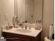Bathroom with a sink vanity, a large mirror and neutral decor at 1292 Hidden Spirit Trl, Lawrenceville, GA 30045