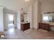 Large bathroom with dual vanities, tile flooring, and glass shower enclosure at 1292 Hidden Spirit Trl, Lawrenceville, GA 30045