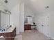 Spacious bathroom with dual vanities, tiled floor, and glass-enclosed shower at 1292 Hidden Spirit Trl, Lawrenceville, GA 30045