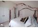 Bedroom featuring a canopy bed with closet and light from a nearby window at 1292 Hidden Spirit Trl, Lawrenceville, GA 30045