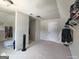 Spacious walk-in closet featuring built-in shelving, hanging storage, and a window at 1292 Hidden Spirit Trl, Lawrenceville, GA 30045