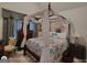 Spacious bedroom featuring a canopy bed, dresser, and decorative accents at 1292 Hidden Spirit Trl, Lawrenceville, GA 30045