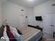 This full bedroom has a TV on the wall and multiple white doors at 1292 Hidden Spirit Trl, Lawrenceville, GA 30045