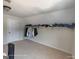 Bedroom closet with overhead shelving and clothes hanging rack for organized storage with a door at 1292 Hidden Spirit Trl, Lawrenceville, GA 30045