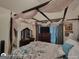 Bedroom featuring a canopy bed with decor, plus a dresser and TV at 1292 Hidden Spirit Trl, Lawrenceville, GA 30045