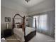 Cozy bedroom with a canopy bed, natural light and bedside tables at 1292 Hidden Spirit Trl, Lawrenceville, GA 30045