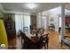 Spacious dining room with hardwood floors, and elegant decor, perfect for entertaining guests at 1292 Hidden Spirit Trl, Lawrenceville, GA 30045