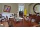 Elegant dining room with hardwood floors, wainscotting, and stylish furnishings at 1292 Hidden Spirit Trl, Lawrenceville, GA 30045