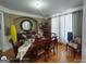 Elegant dining room with hardwood floors, stylish furnishings, and a sophisticated ambiance at 1292 Hidden Spirit Trl, Lawrenceville, GA 30045