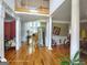 Grand foyer with gleaming hardwood floors, soaring ceilings, elegant columns, and abundant natural light at 1292 Hidden Spirit Trl, Lawrenceville, GA 30045