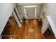 Foyer featuring hardwood floors, white columns, and natural light at 1292 Hidden Spirit Trl, Lawrenceville, GA 30045