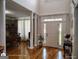 Inviting foyer with hardwood floors, elegant columns, and natural light at 1292 Hidden Spirit Trl, Lawrenceville, GA 30045