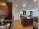 Elegant kitchen with a center island, dark granite countertops, and custom wood cabinets at 1292 Hidden Spirit Trl, Lawrenceville, GA 30045