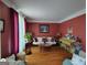 Charming living room with hardwood floors, warm lighting, a classic piano, and inviting seating at 1292 Hidden Spirit Trl, Lawrenceville, GA 30045