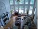 Bright, open living room with large windows, fireplace, hardwood floors, and comfortable seating at 1292 Hidden Spirit Trl, Lawrenceville, GA 30045