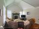 Inviting living room featuring large windows, a fireplace, and comfortable seating at 1292 Hidden Spirit Trl, Lawrenceville, GA 30045