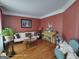 Inviting living room with hardwood floors, soft lighting, comfortable seating, and stylish decor at 1292 Hidden Spirit Trl, Lawrenceville, GA 30045