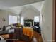 Cozy living room with vaulted ceilings, a fireplace, and lots of natural light at 1292 Hidden Spirit Trl, Lawrenceville, GA 30045