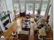 Bright, open living room with large windows, fireplace, hardwood floors, and comfortable seating at 1292 Hidden Spirit Trl, Lawrenceville, GA 30045