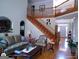 Elegant living room showcasing the staircase, hardwood floors, and comfortable seating area at 1292 Hidden Spirit Trl, Lawrenceville, GA 30045