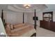 Spacious main bedroom showcasing a luxurious four-poster bed, tray ceiling, dresser, and ample closet space at 1292 Hidden Spirit Trl, Lawrenceville, GA 30045