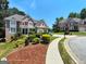 Beautiful brick home with landscaped front yard, driveway, and charming curb appeal at 1292 Hidden Spirit Trl, Lawrenceville, GA 30045