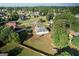 Bird's-eye view of the property highlighting the expansive, fenced backyard with mature trees and lush landscaping at 609 Alyssa Ct, Locust Grove, GA 30248