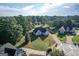 Expansive aerial view of a beautiful home, showcasing its large lot and wooded surroundings at 609 Alyssa Ct, Locust Grove, GA 30248