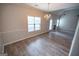 Bright dining area with a chandelier, large window, and easy access to the living spaces at 609 Alyssa Ct, Locust Grove, GA 30248