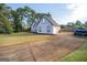 Well maintained home with a large front yard and a long driveway at 609 Alyssa Ct, Locust Grove, GA 30248
